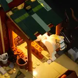 Close-up overhead view of illuminated stable interior.