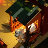 Top-down view of illuminated stable interior.