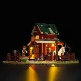 Night view of Lumibricks Ranch Duel 14017 with illuminated sign and campfire.