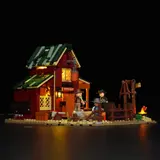 Night view of back of Lumibricks Ranch Duel barn with glowing windows.
