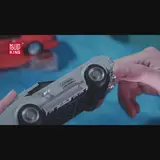 Underside of a grey brick car model.