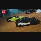 Mould King police car model with other brick cars in background.
