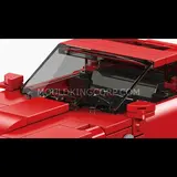 Sleek side profile of the red vintage car model.